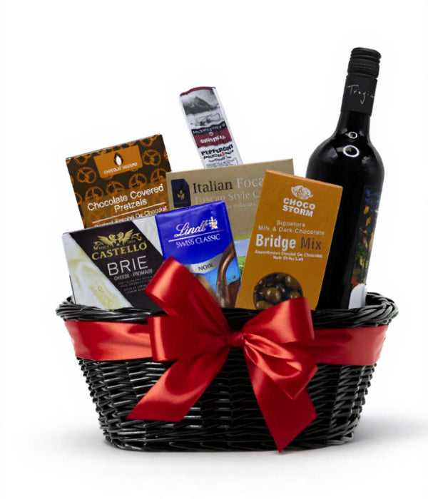 Red wine and cheese basket with gourmet snacks