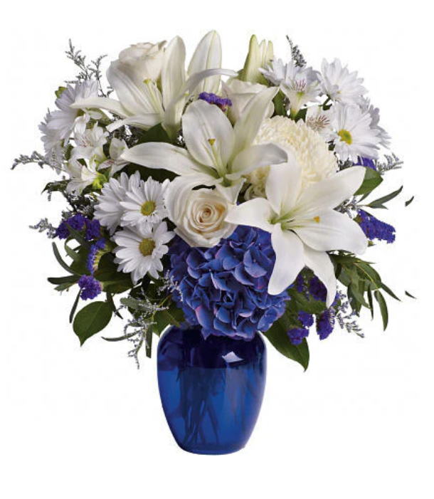 flower arrangement in a blue vase